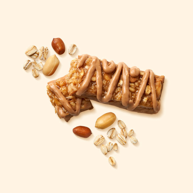 Wellina Peanut Butter Oat Bar, a chewy peanut butter oat bar, shown unwrapped beside its wrapper